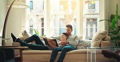 couple-on-couch-reading-book-together