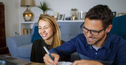 young-couple-doing-paperwork-in-living-room