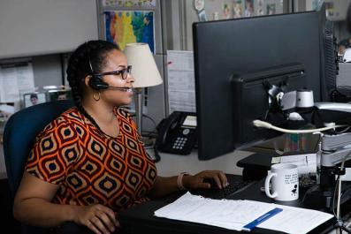LGA call center representative in office LGA call center representative in office with headset on