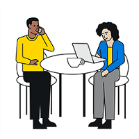 Two people at a table with laptop