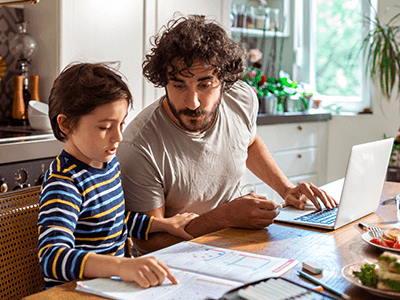 Father helping son with homework Father helping son with homework