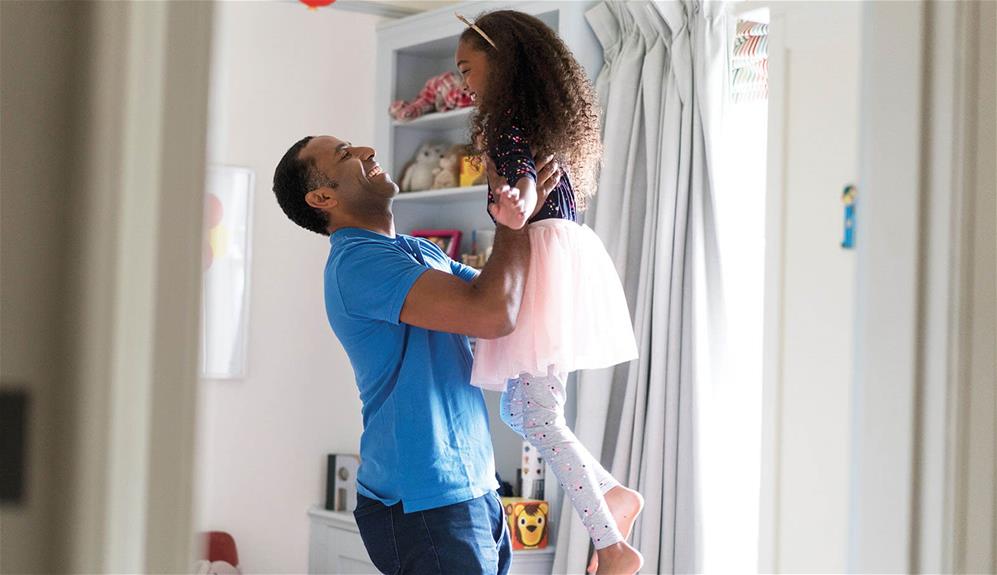 dad-lifting-daughter-up-while-dancing