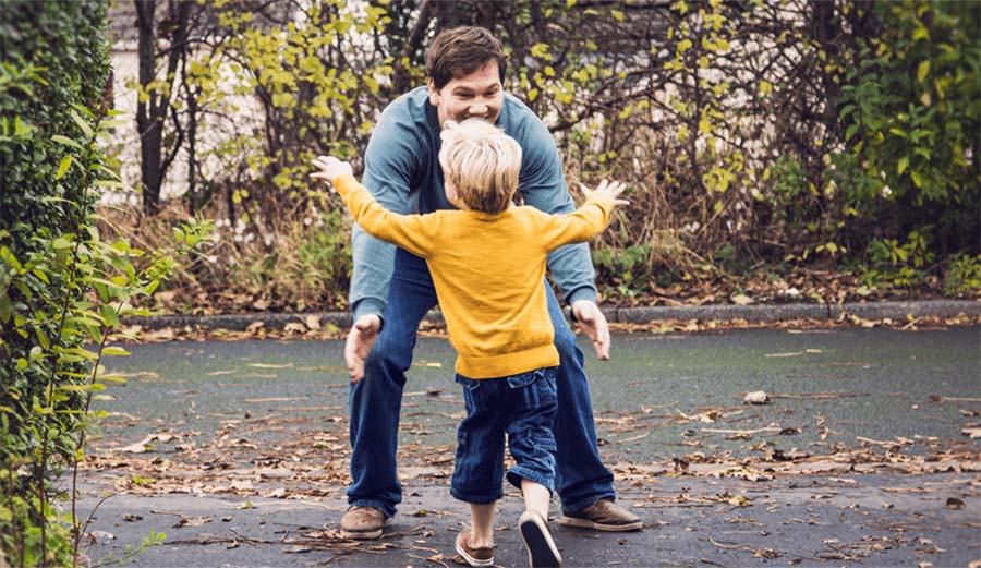 son hugging dad